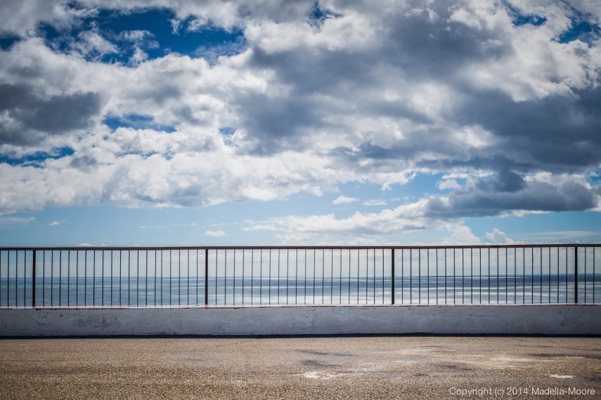 Railing between land and sea