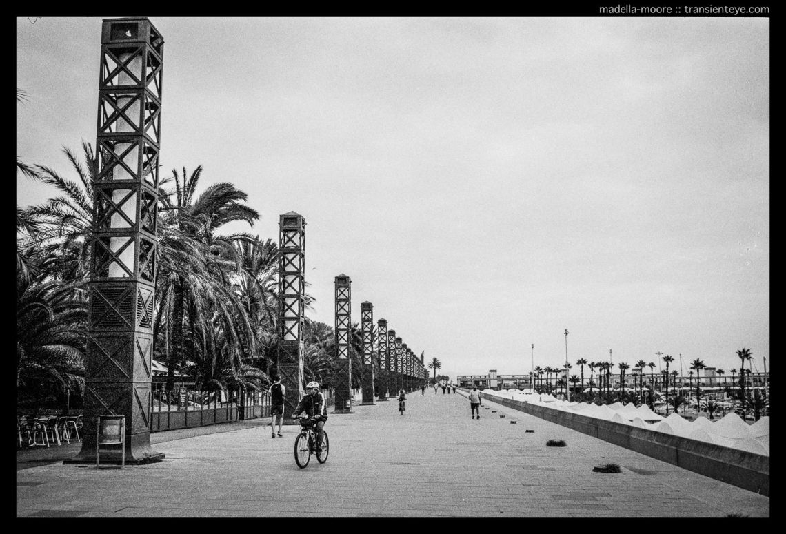 The promenade alongside the marina at Port Olimpic, Barcelona. Leica M7, Zeiss ZM 2/35 Biogon with Ilford HP5+.