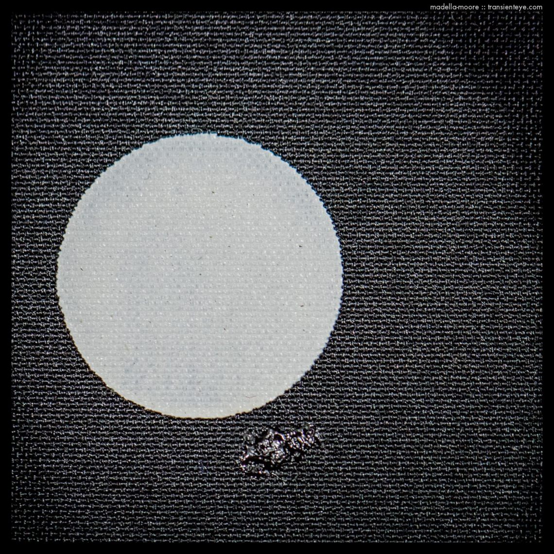 The patched Leica shutter curtain burn hole, seen from the front.