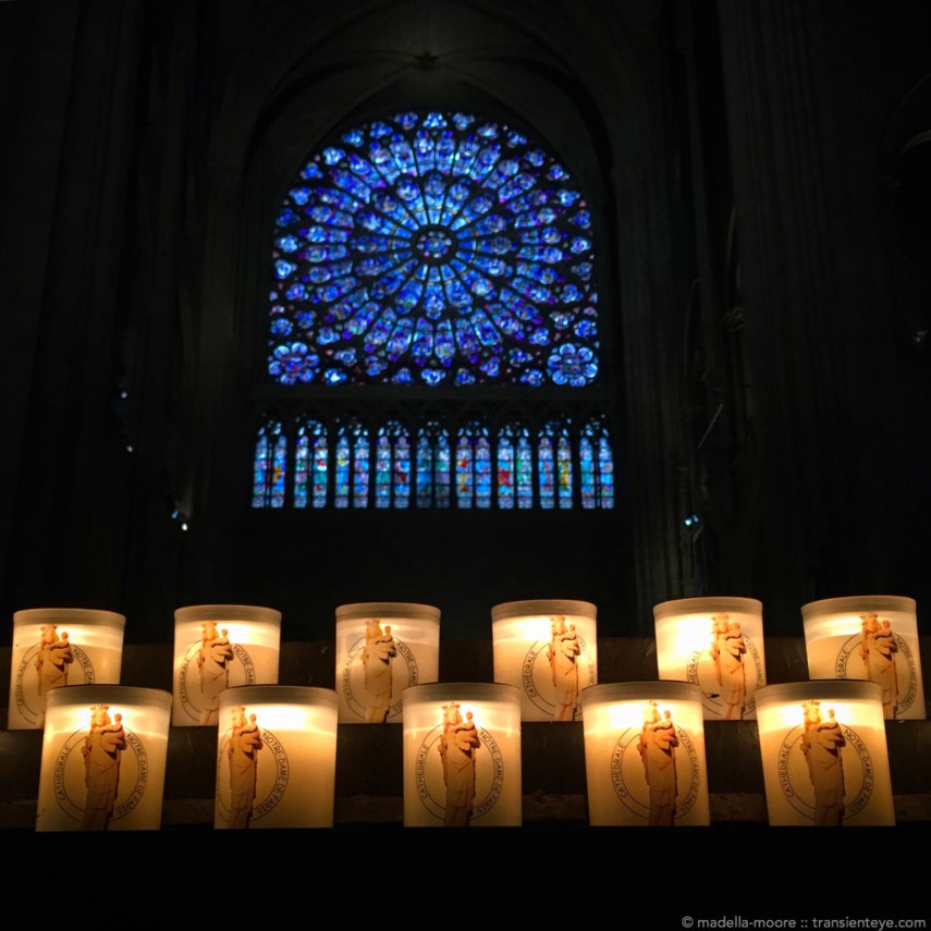 Candles and windows at Notre Dame.