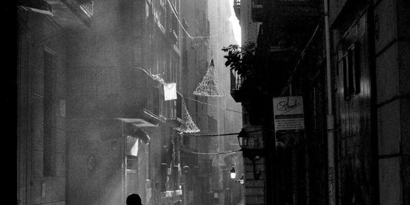 Noir-style street photograph in Barcelona. Shot using a FED 5b and Delta 100 film.
