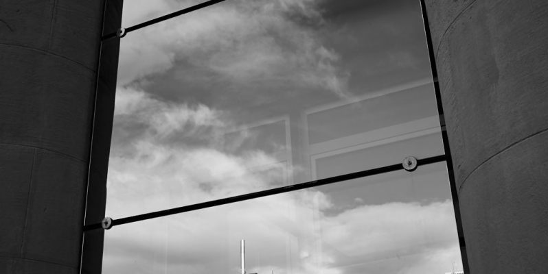 Las Arenas, seen in reflection from Fira on the Monjuic. Ricoh GR B&W.