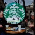 Two tourists in a protest-stickered Starbucks, Ocupació Popular de les Rambles, Barcelona, January&nbsp;2017