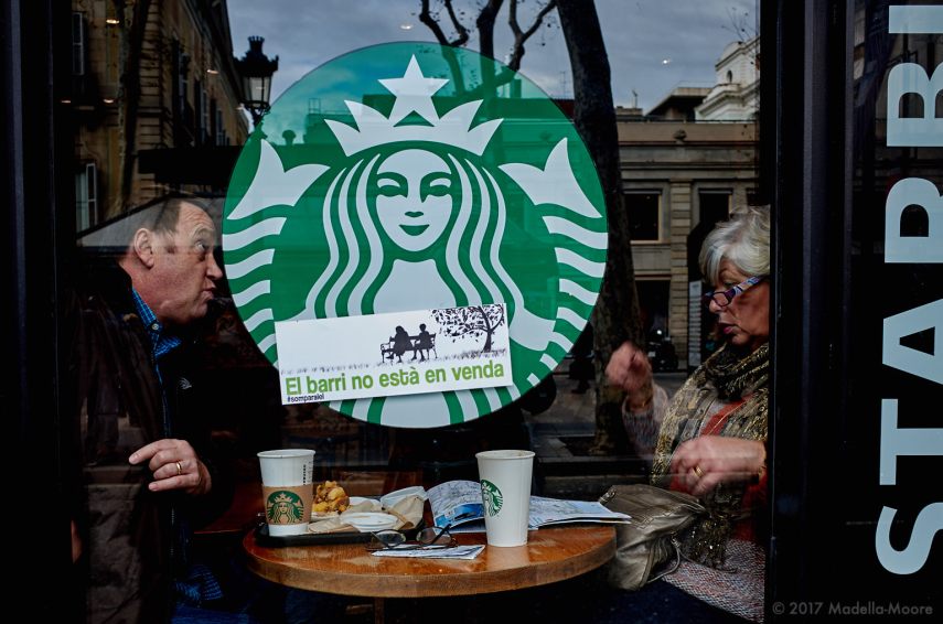 Two tourists in a protest-stickered Starbucks, Ocupació Popular de les Rambles, Barcelona, January 2017
