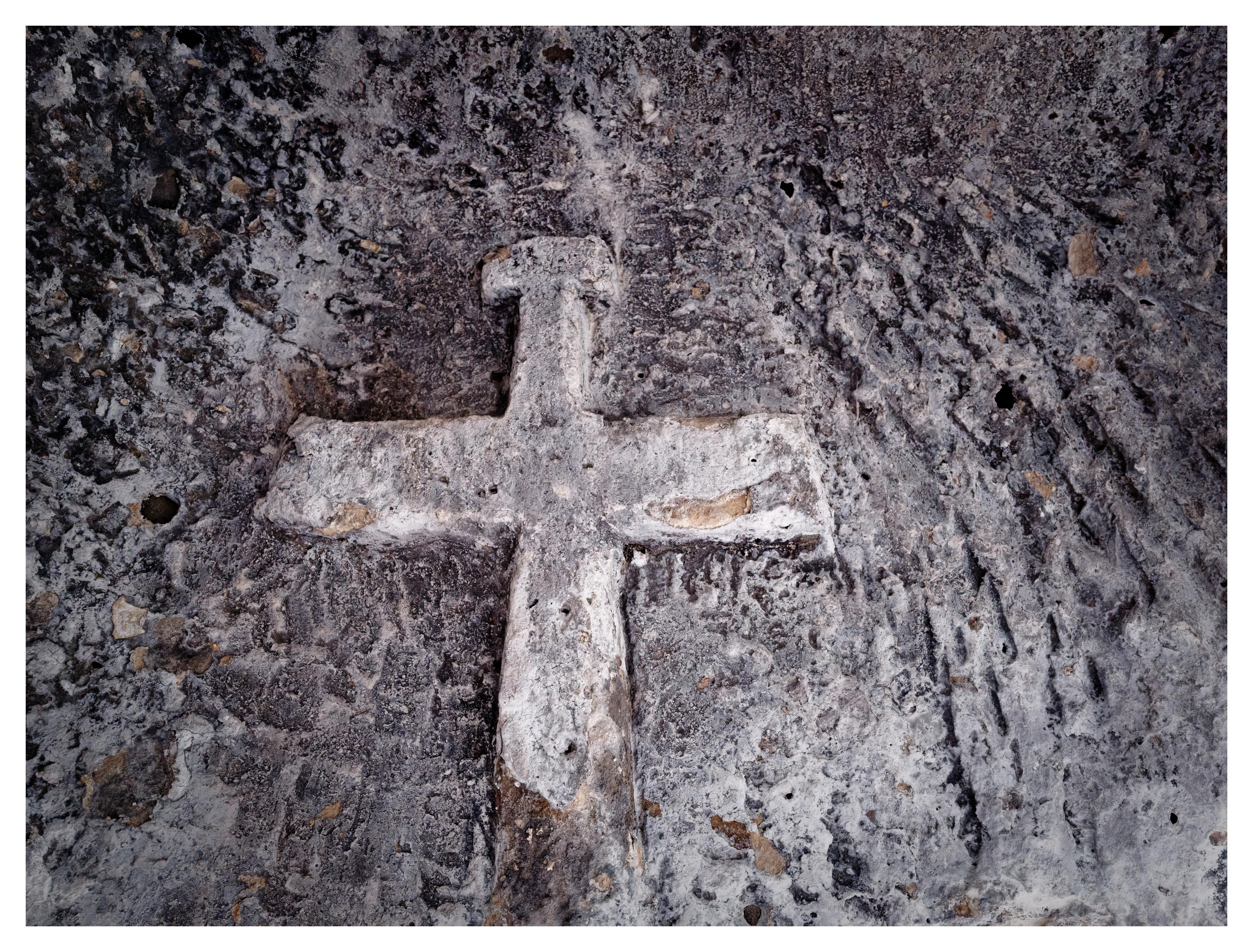 A cross carved in a roof